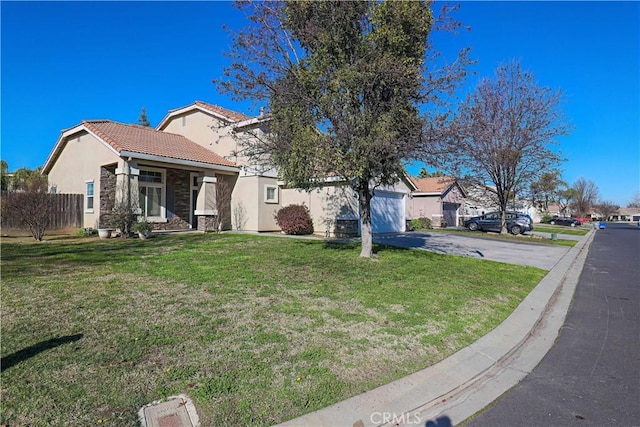 view of front of home with a garage and a front yard