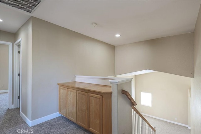 hallway featuring carpet flooring