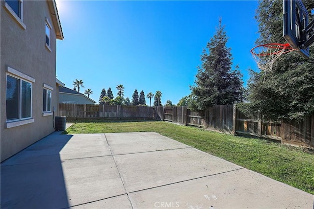 view of yard featuring central AC unit and a patio area