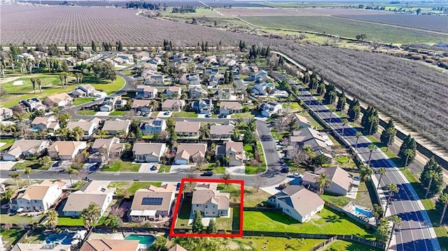 birds eye view of property with a rural view