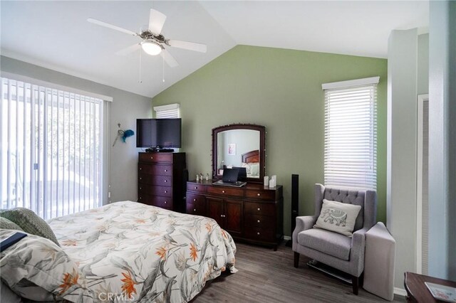 bedroom featuring ceiling fan, vaulted ceiling, dark wood-type flooring, and access to outside