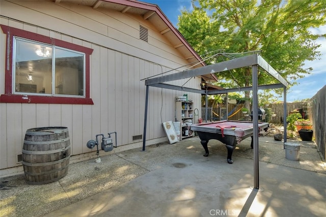 view of side of home with a patio area