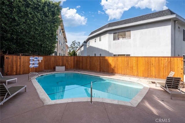 view of pool with a patio area, a fenced backyard, and a fenced in pool