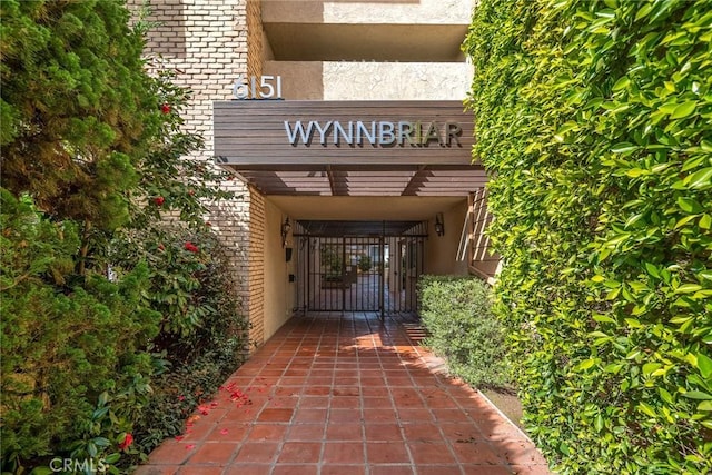 entrance to property with brick siding