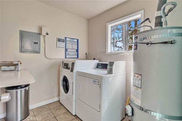 washroom with secured water heater, washing machine and clothes dryer, light tile patterned floors, electric panel, and baseboards