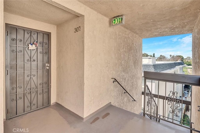 entrance to property with a balcony