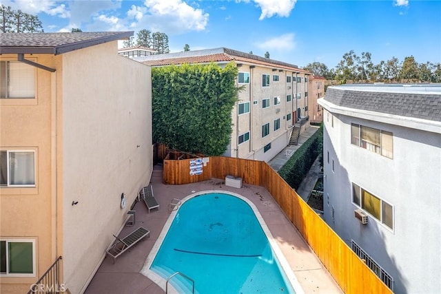 pool featuring a fenced backyard