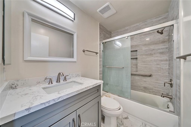 bathroom with marble finish floor, shower / bath combination with glass door, visible vents, toilet, and vanity