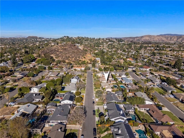 birds eye view of property with a mountain view