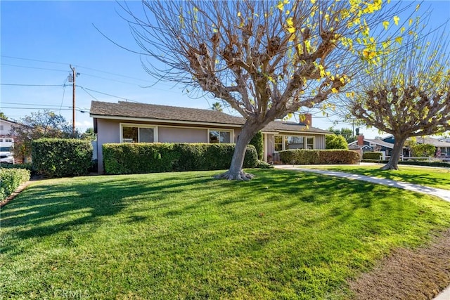 ranch-style home with a front yard