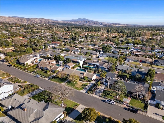 birds eye view of property with a mountain view