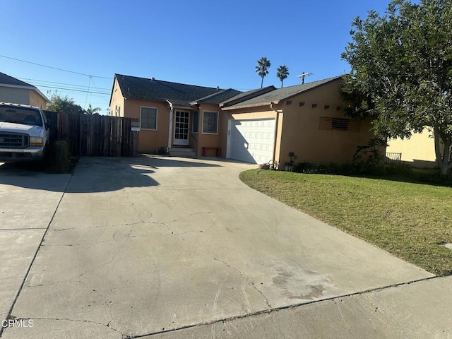 view of front of property featuring a front lawn and a garage