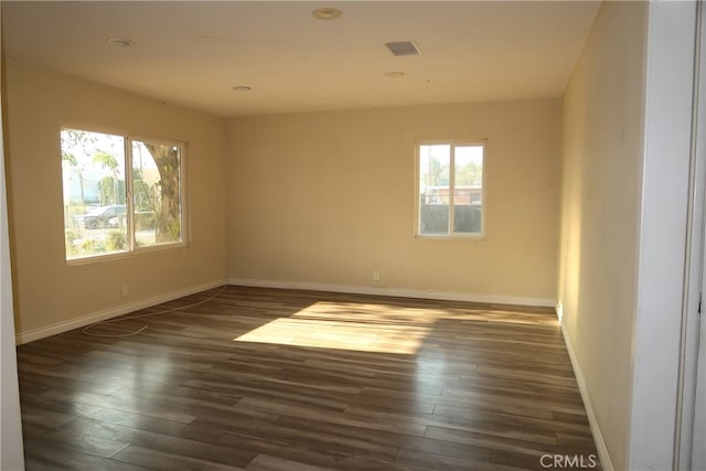 empty room featuring dark wood-type flooring