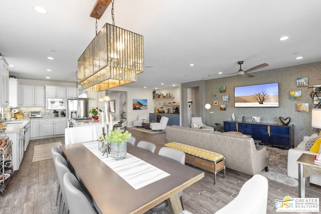 dining area featuring ceiling fan and sink