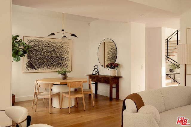 dining room featuring ceiling fan and wood-type flooring