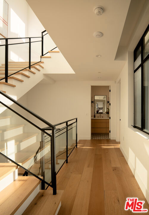 hallway with wood-type flooring