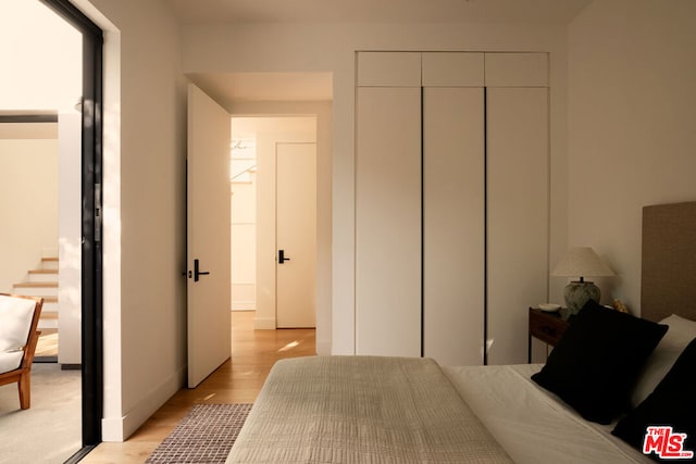 bedroom with light hardwood / wood-style floors