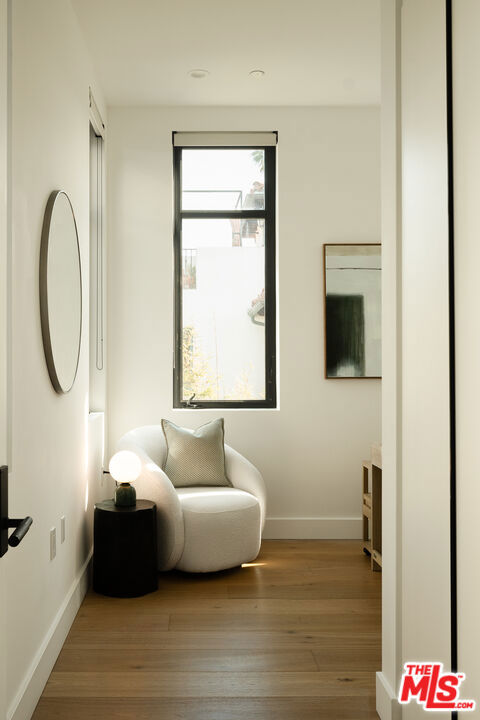 sitting room featuring hardwood / wood-style flooring