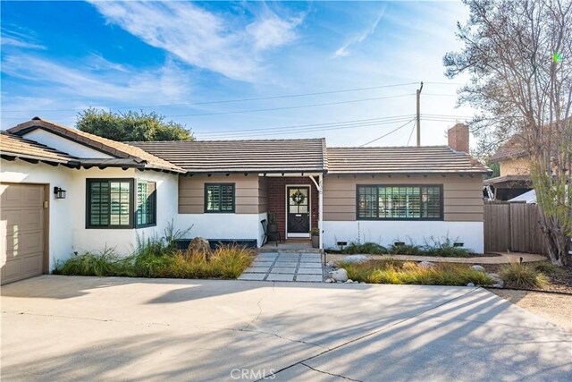 single story home featuring a garage