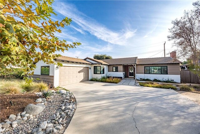 single story home featuring a garage