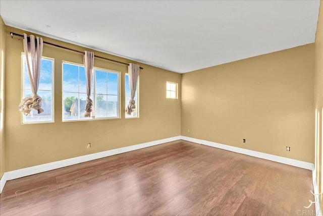 spare room featuring hardwood / wood-style floors