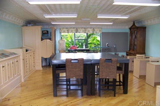 dining area with light hardwood / wood-style flooring