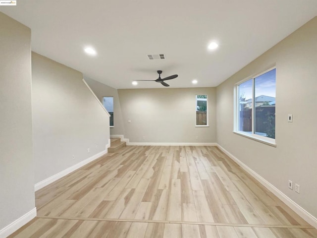 unfurnished living room featuring light wood-type flooring and ceiling fan