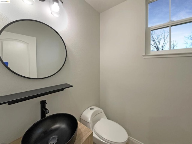 bathroom featuring toilet and sink