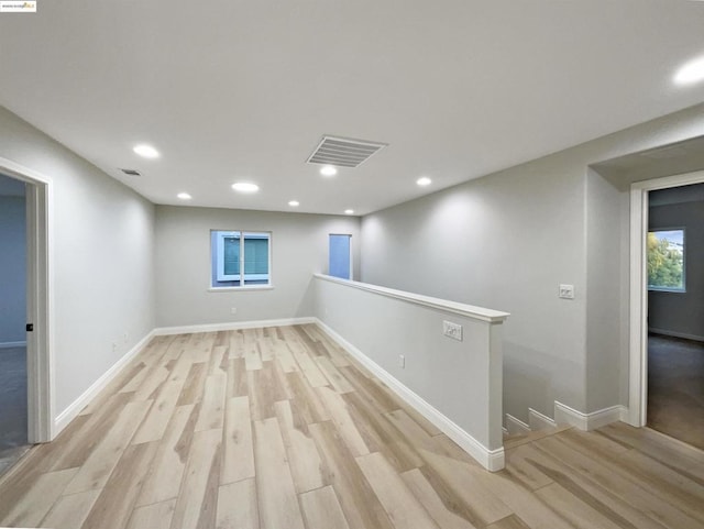 spare room with light wood-type flooring