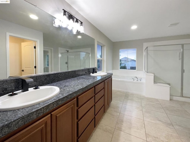 bathroom featuring vanity, tile patterned floors, and plus walk in shower