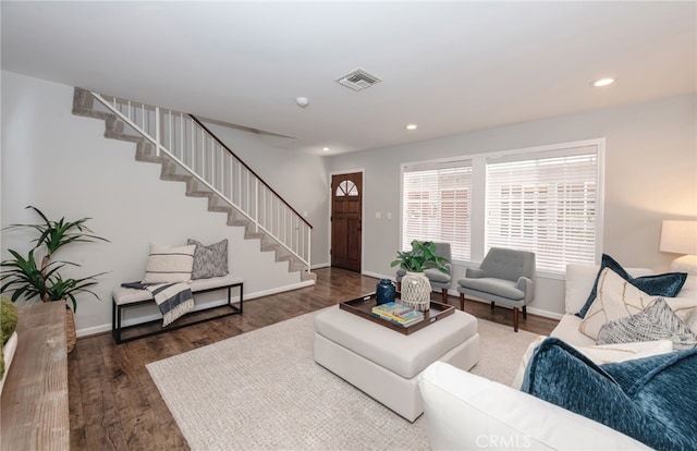 living room featuring dark wood-type flooring