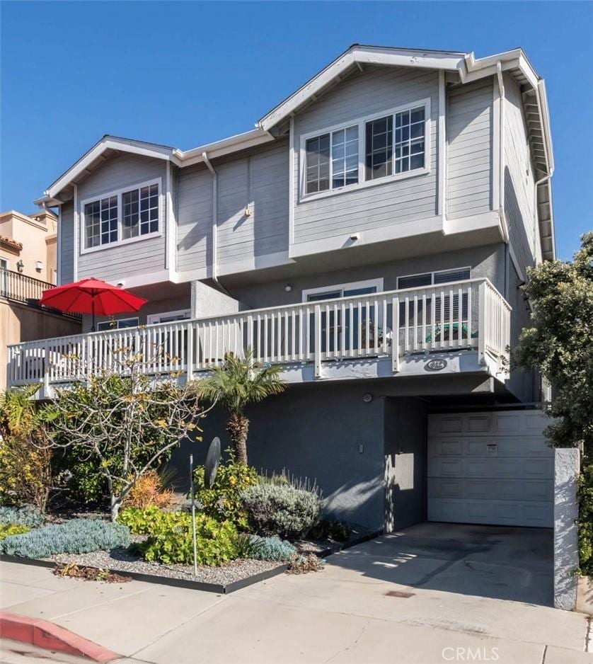 view of front property with a balcony and a garage