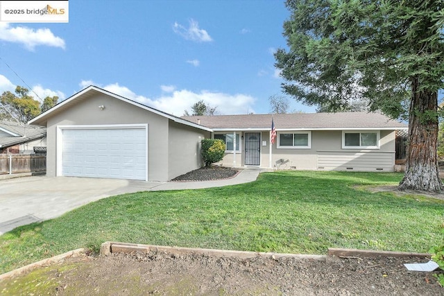 ranch-style home with a front lawn and a garage