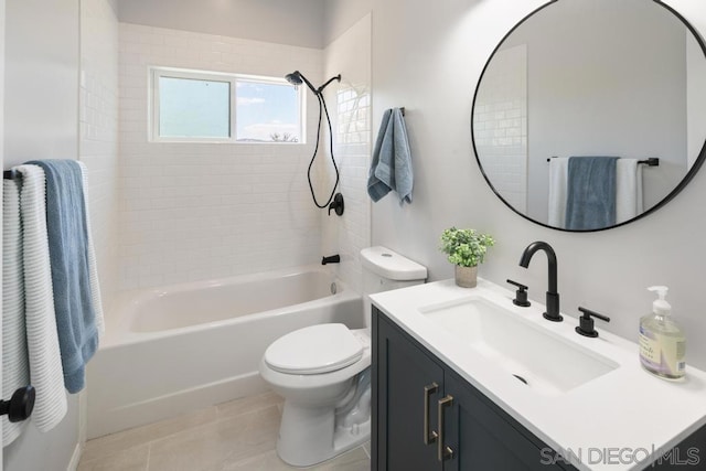 full bathroom with toilet, vanity, tiled shower / bath, and tile patterned flooring