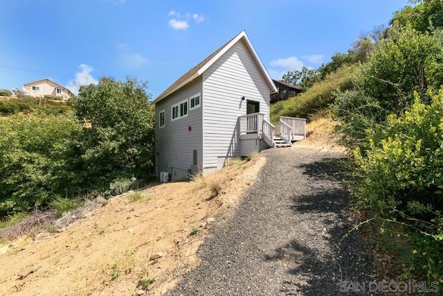 view of side of property featuring a deck