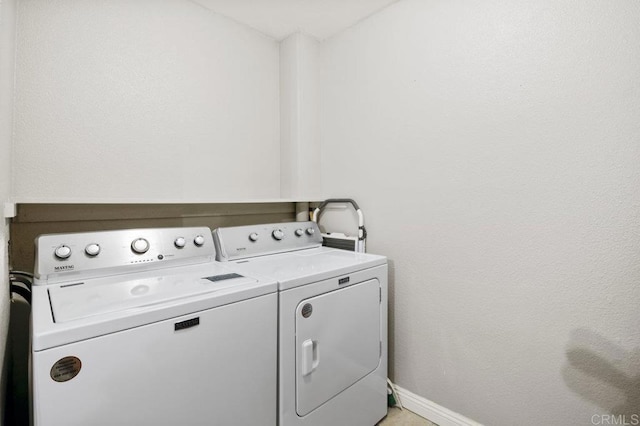 laundry area with independent washer and dryer