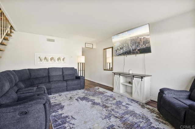 living room with dark hardwood / wood-style floors