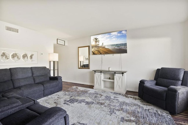 living room featuring dark wood-type flooring