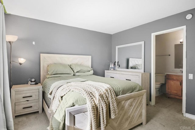 carpeted bedroom with ensuite bathroom