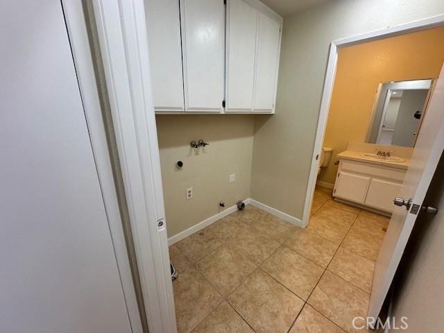 laundry area featuring cabinets, hookup for a gas dryer, electric dryer hookup, washer hookup, and sink