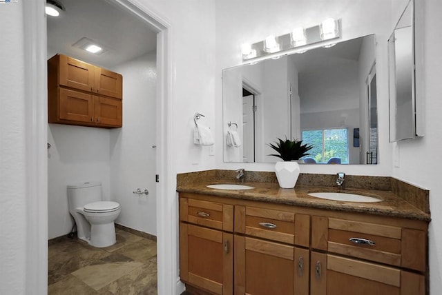 bathroom with toilet and vanity