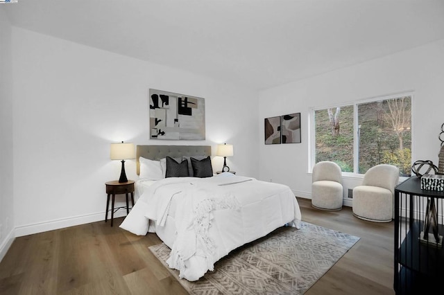 bedroom with hardwood / wood-style flooring