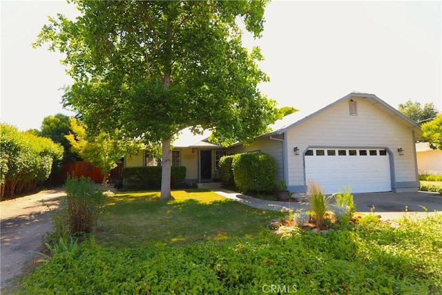 single story home featuring a front yard and a garage