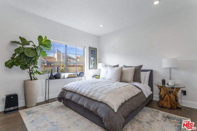 bedroom with hardwood / wood-style floors