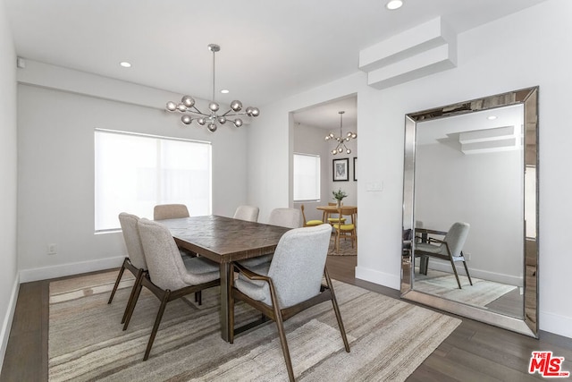 dining area featuring a chandelier and hardwood / wood-style flooring