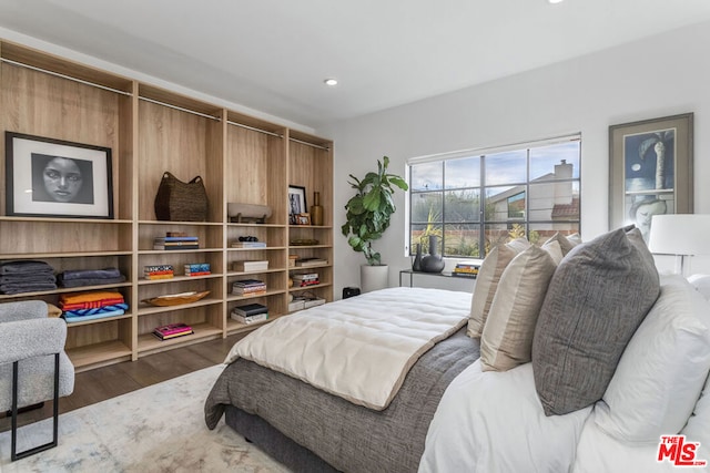 bedroom with wood-type flooring