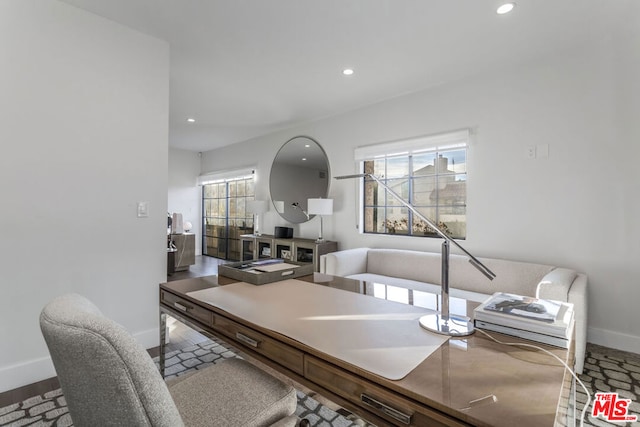 home office with hardwood / wood-style floors