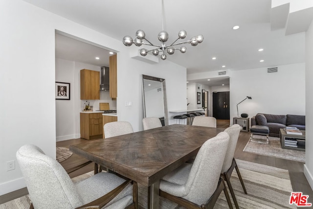 dining room featuring an inviting chandelier and wood-type flooring