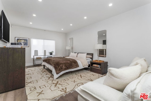 bedroom with light wood-type flooring