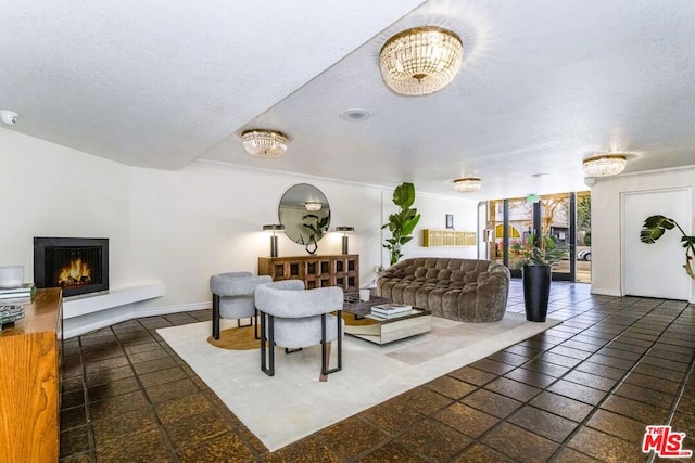 living room with a textured ceiling and a chandelier